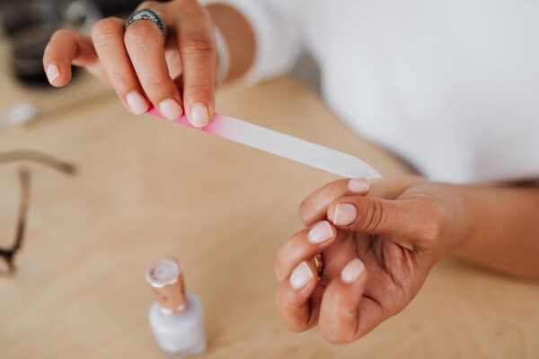 A person filing their nails