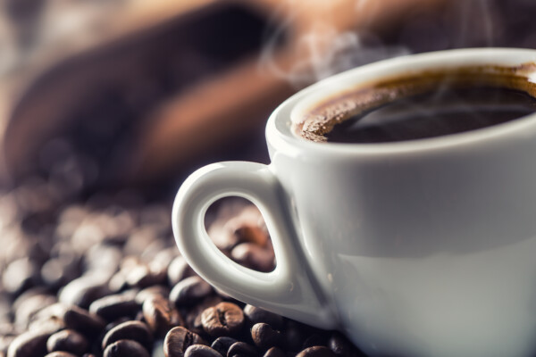 Cup of coffee with beans
