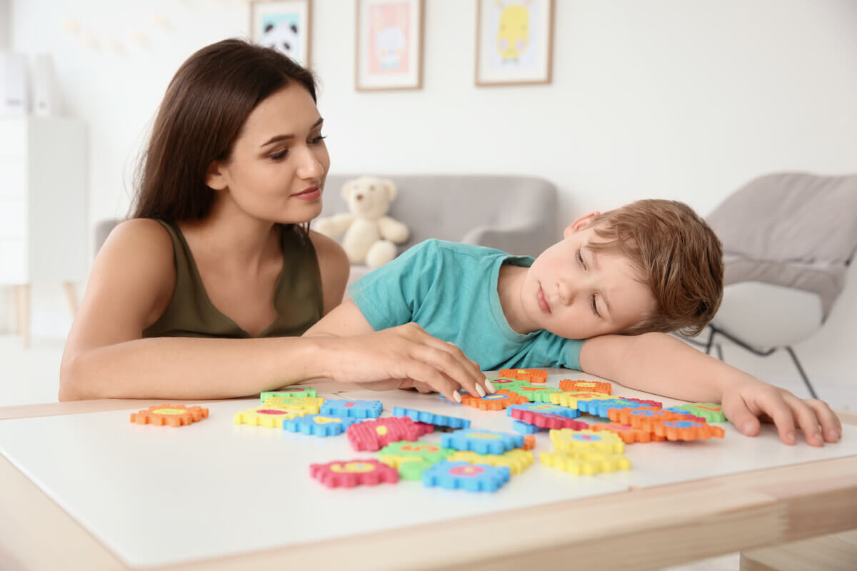 Mother working with child who has autism