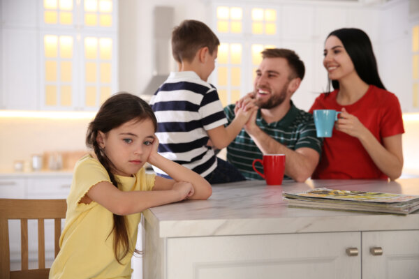 Young girl upset over parents giving more attention to their son
