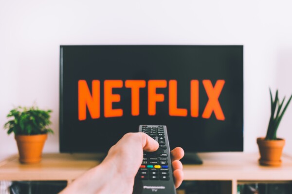 Person watching Netflix on TV