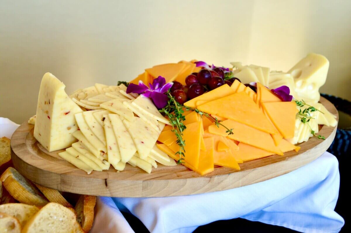 sliced cheese on brown wooden chopping board, best types of cheese
