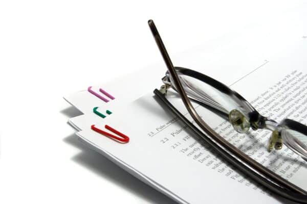 Glasses on top of a scientific research paper