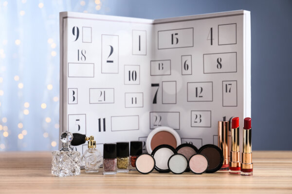 A beauty advent calendar with makeup, nail polish, and perfumes