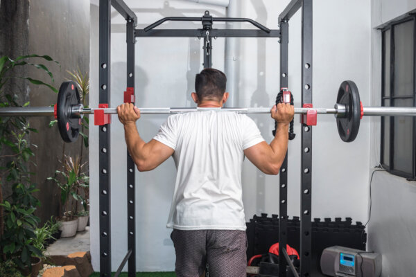 A man working out with his home gym equipment