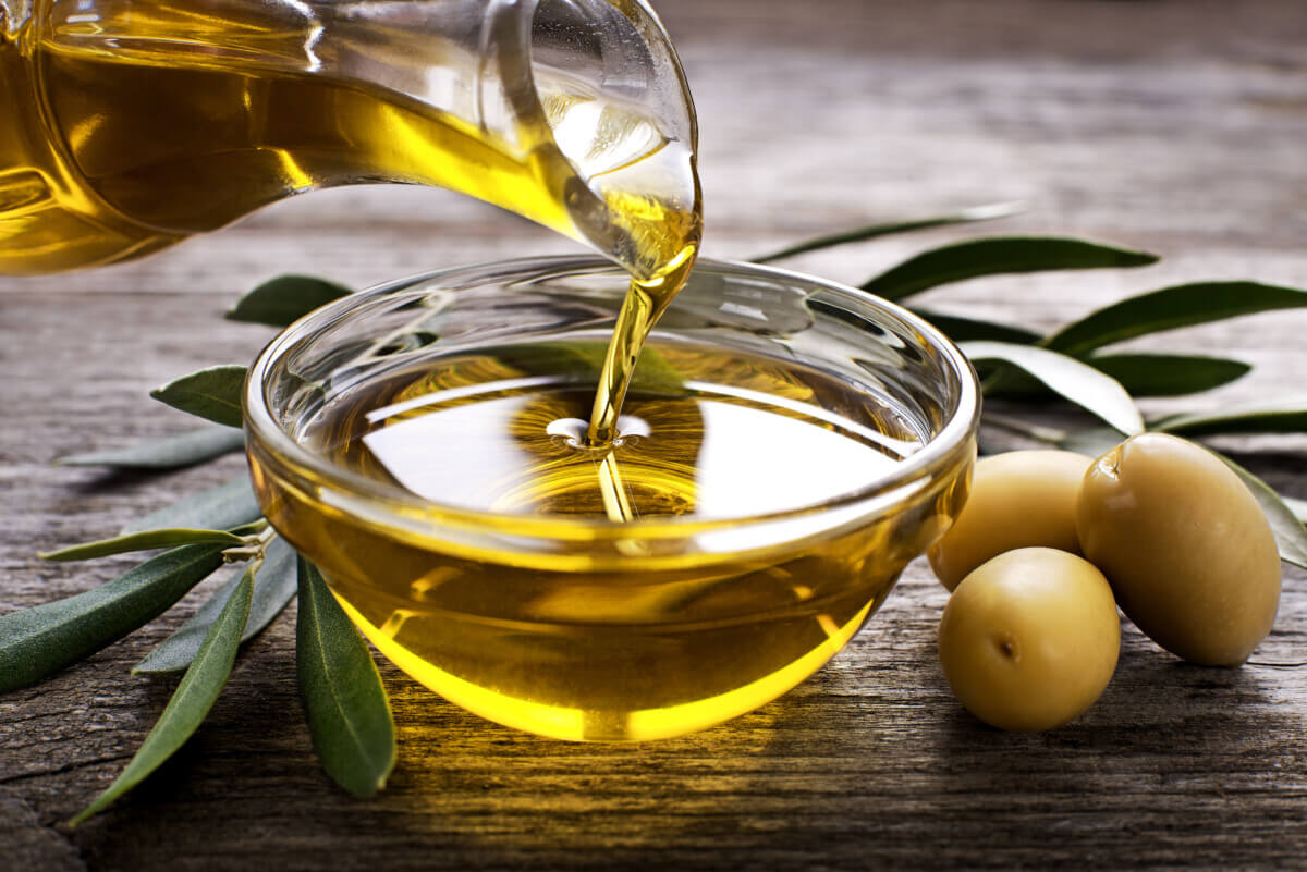 Olive oil being poured into a bowl