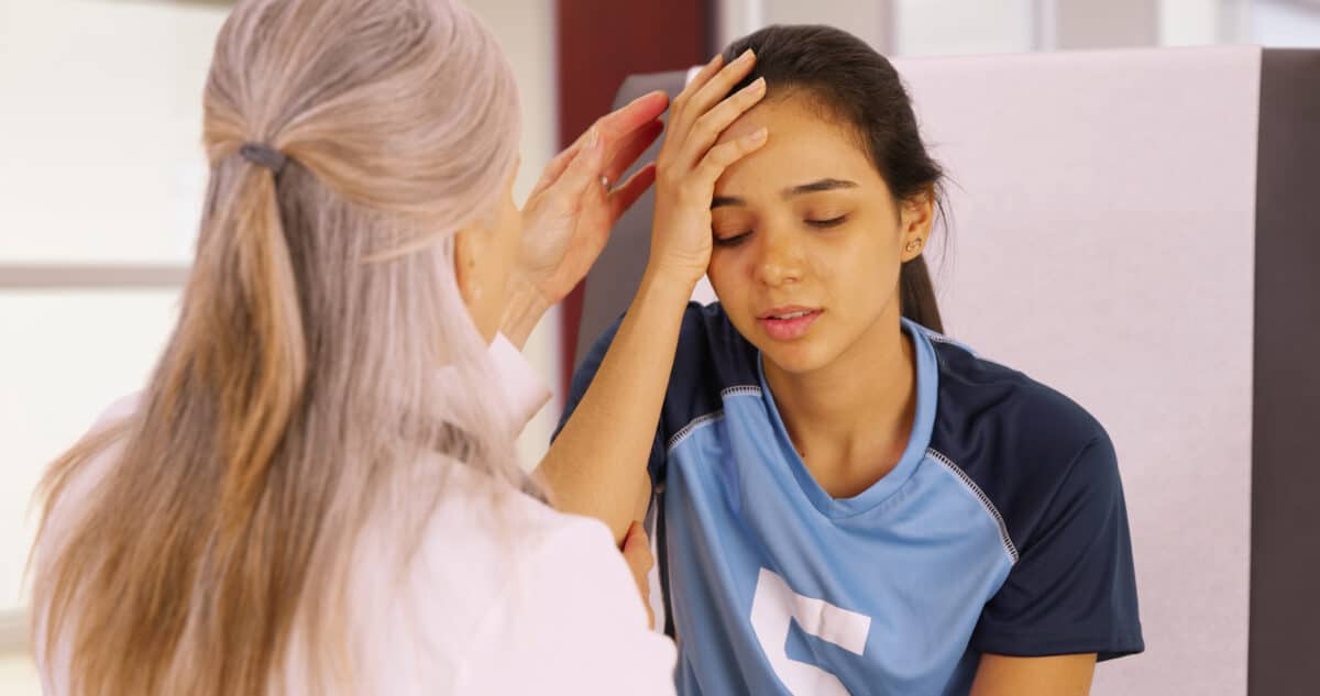 Soccer player with head injury or concussion