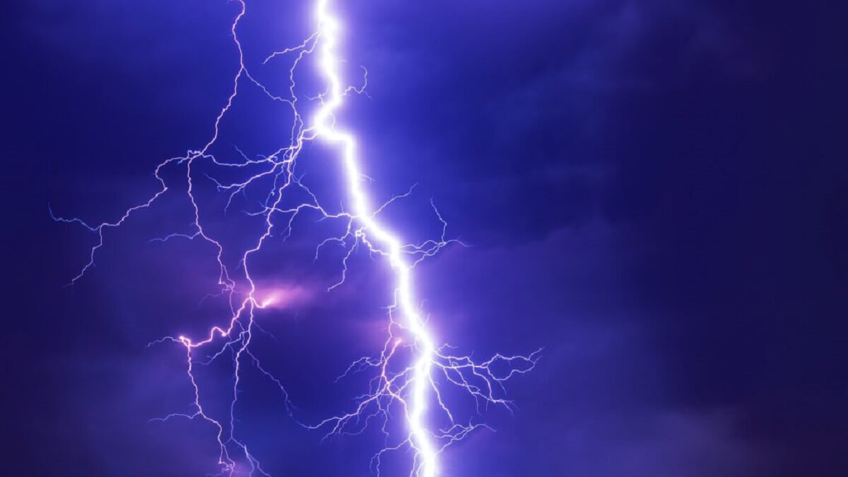 pic of a lightning bolts flashing through a dark blue sky