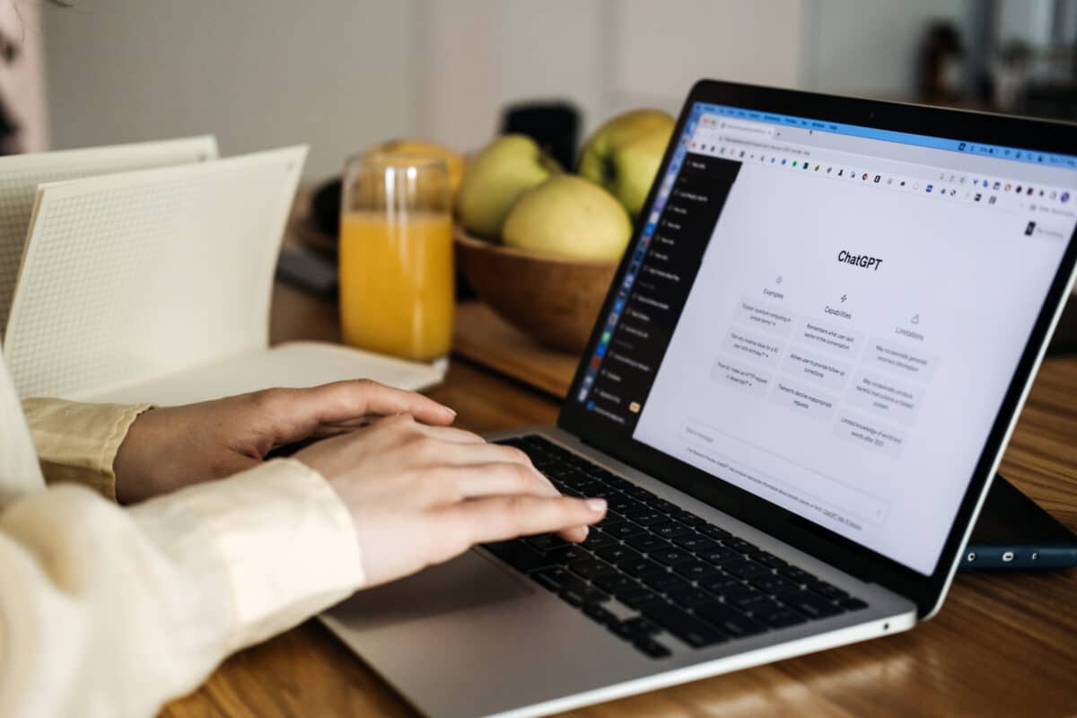 Worker or student using ChatGPT on their laptop computer